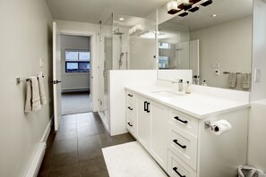 Bathtub, hair dryer, towels, soap