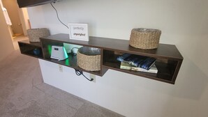 A shelf with a sign reading "perfectly imperfect," containing books, a small heater, and woven baskets. - New house with fresh design available in Olsen TH. (Tucson)
