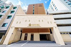 A hotel entrance with a modern design, featuring a prominent logo and signage for 'Centro Stay.' - CentroStay (Incheon)