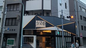 A modern hotel with a prominent entrance, multiple floors, and a clear view of the street. - COB HOTEL ASAKUSA (Tokyo)