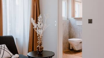 Standard Suite | Bathroom | Shower, hair dryer, towels, soap