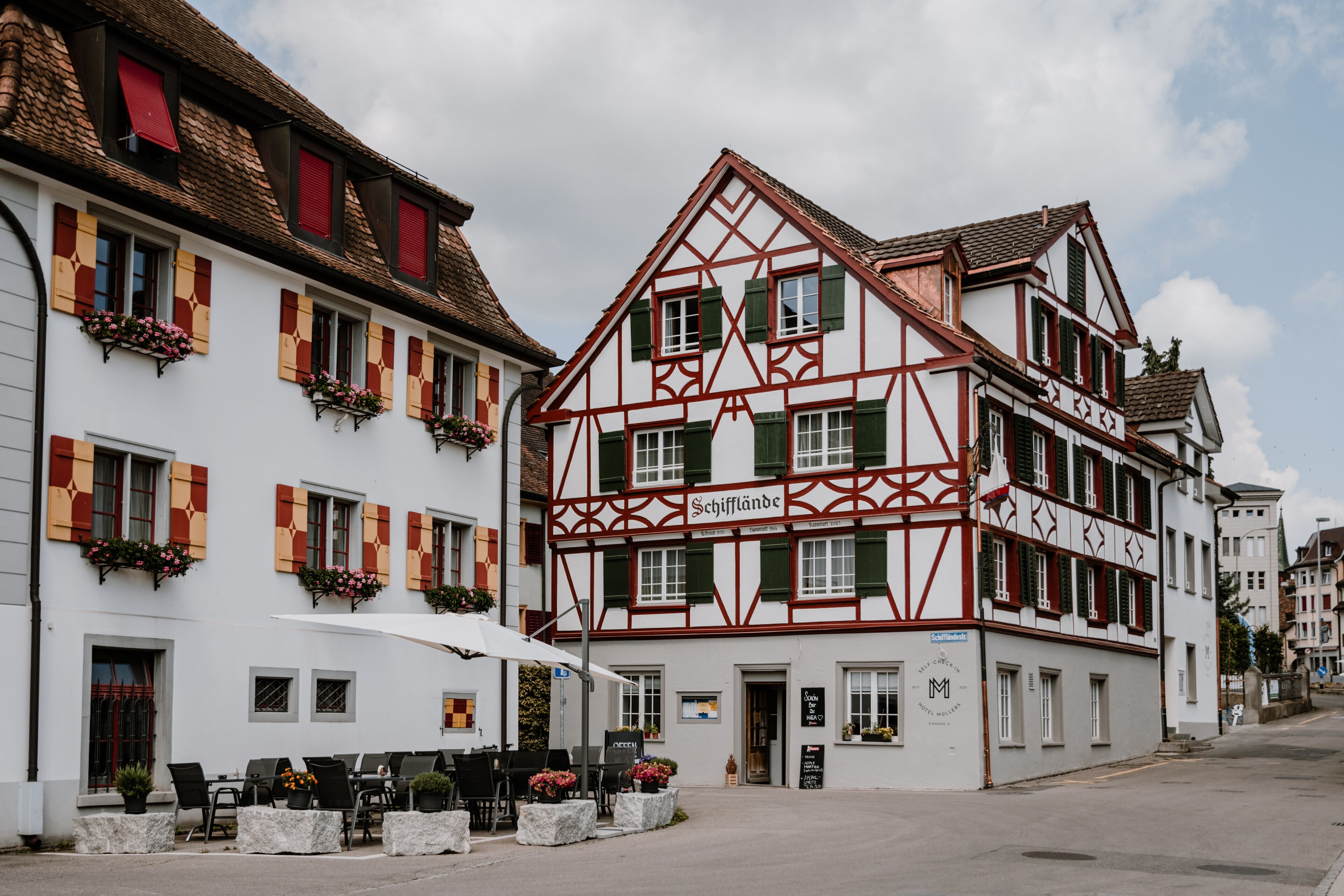 A traditional half-timbered building with a sign reading "Schiffländer".