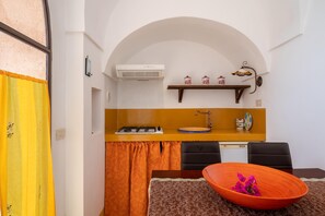 Fridge, stovetop, cookware/dishes/utensils, dining tables