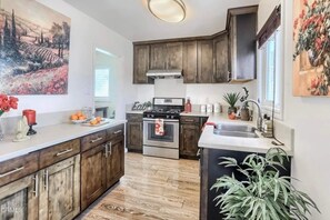 Fridge, microwave, stovetop, coffee/tea maker