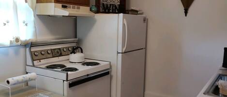 Fridge, microwave, stovetop, coffee/tea maker