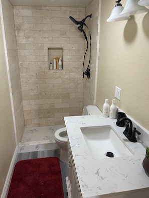 Shower, jetted tub, hair dryer, towels