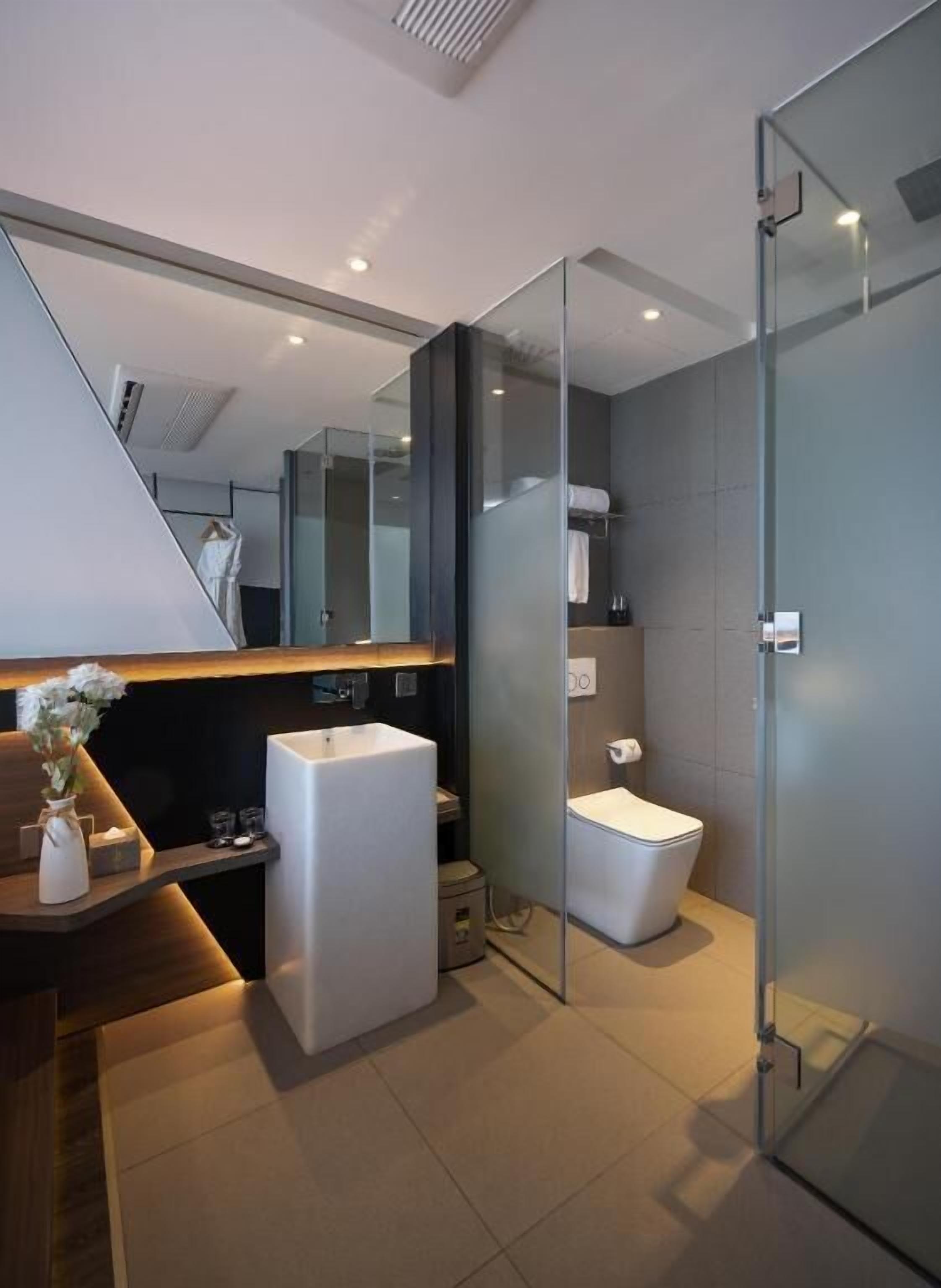 Bathroom | Designer toiletries, hair dryer, bathrobes, slippers