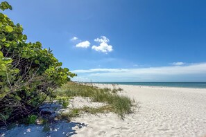 On the beach, sun loungers, beach towels