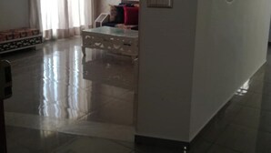 A spacious living area with a large window, a sofa, a coffee table, and a chandelier. - 1 km From Mansoura Kélibia Beach (Kelibia)