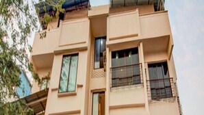 A multi-story building with a sign reading "WE STAY". - We Stay - Andheri (Mumbai)
