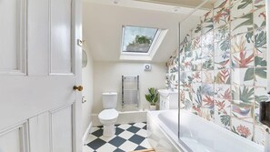 Bathtub, hair dryer, towels