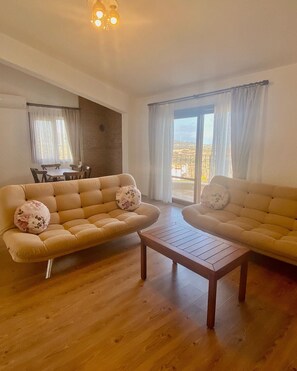 Family Apartment | Living area | 50-inch LCD TV with premium channels, TV - Vista Garden Datca (Datça)