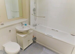 Bathtub, hair dryer, towels, soap