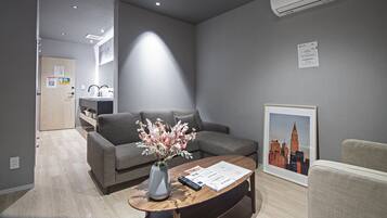 Elite Apartment | Living room | 25-inch flat-screen TV with cable channels