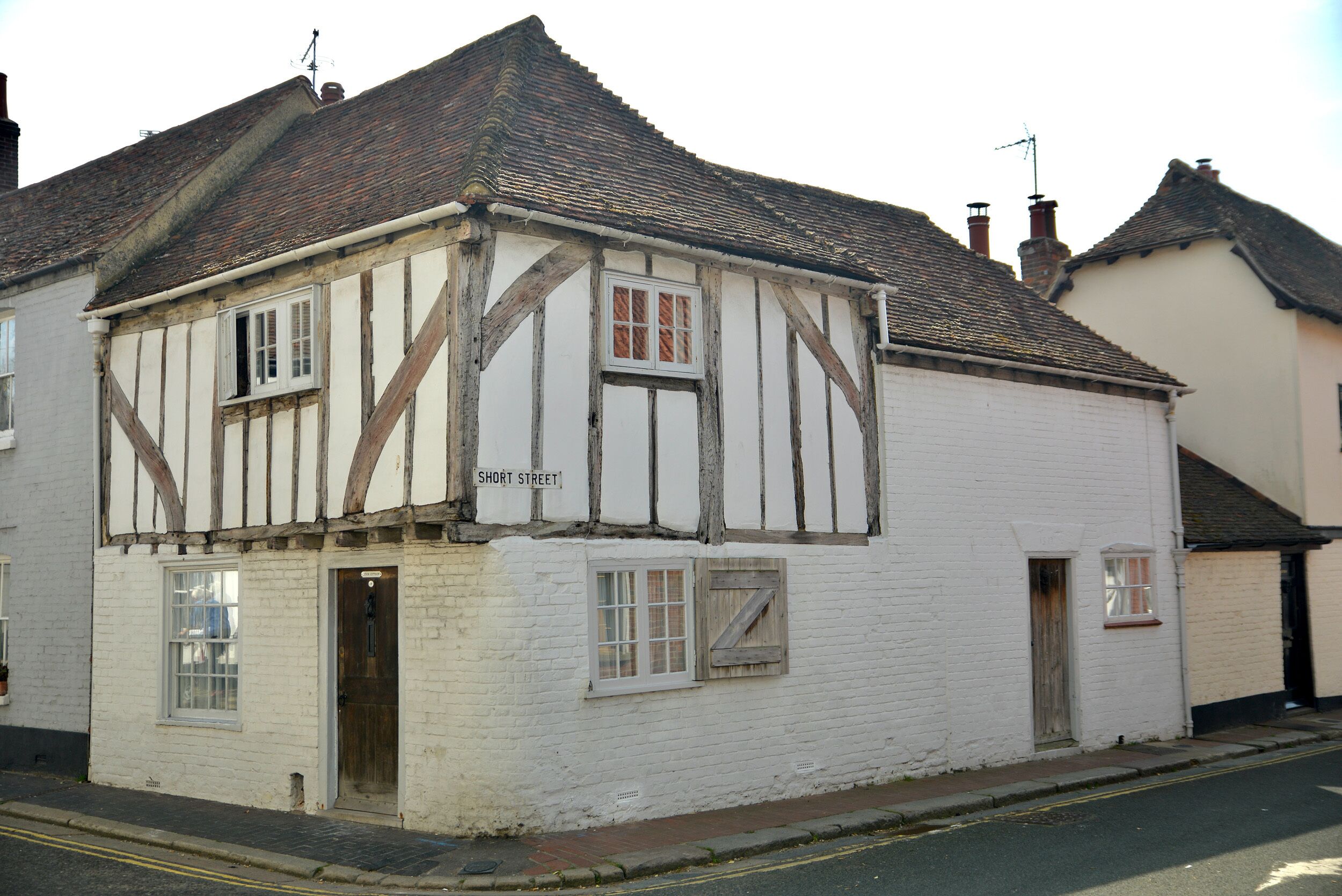 A traditional half-timbered building with a sign reading 'SHORT STREET.'