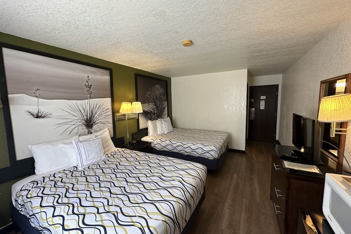 economy double room, 2 queen beds, non smoking | desk, iron/ironing board, free wifi, bed sheets