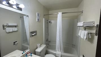 Economy Single Room, 1 King Bed, Non Smoking | Bathroom | Bathtub, hair dryer, bathrobes, towels