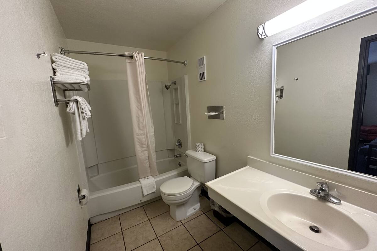 economy triple room, multiple beds, non smoking | bathroom | bathtub, hair dryer, dressing gowns, towels