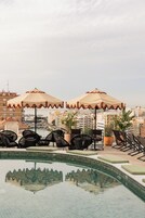 Seasonal outdoor pool, pool umbrellas, pool loungers