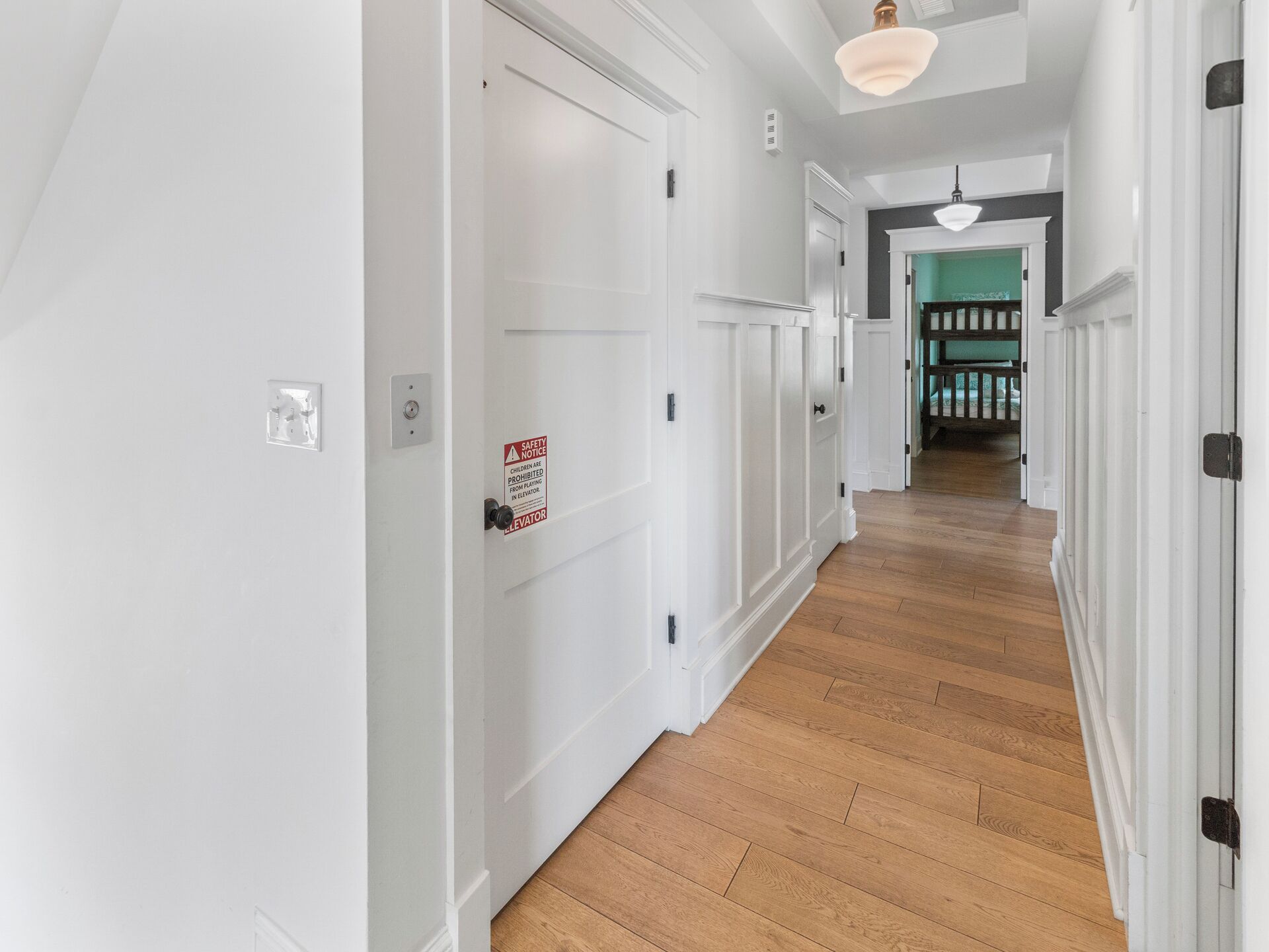 Mid level North facing Hallway and elevator entrance