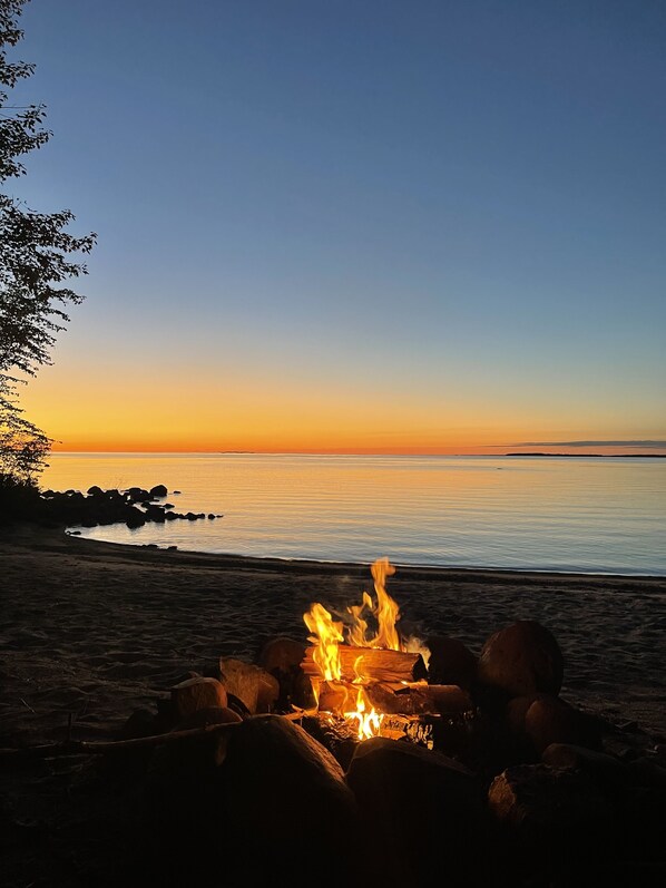 On the beach, sun-loungers