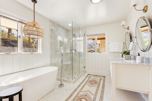 Combined shower/tub, hair dryer, towels, soap