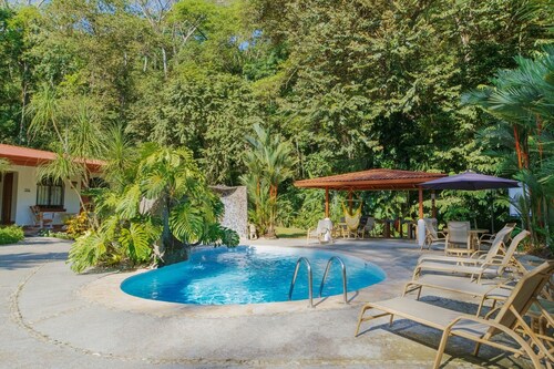 Private suite 103 with beautiful gardens, shared pool and BBQ area!