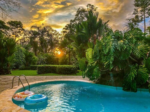 Private suite 103 with beautiful gardens, shared pool and BBQ area!