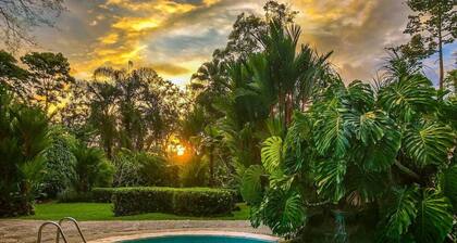 Private suite 103 with beautiful gardens, shared pool and BBQ area!