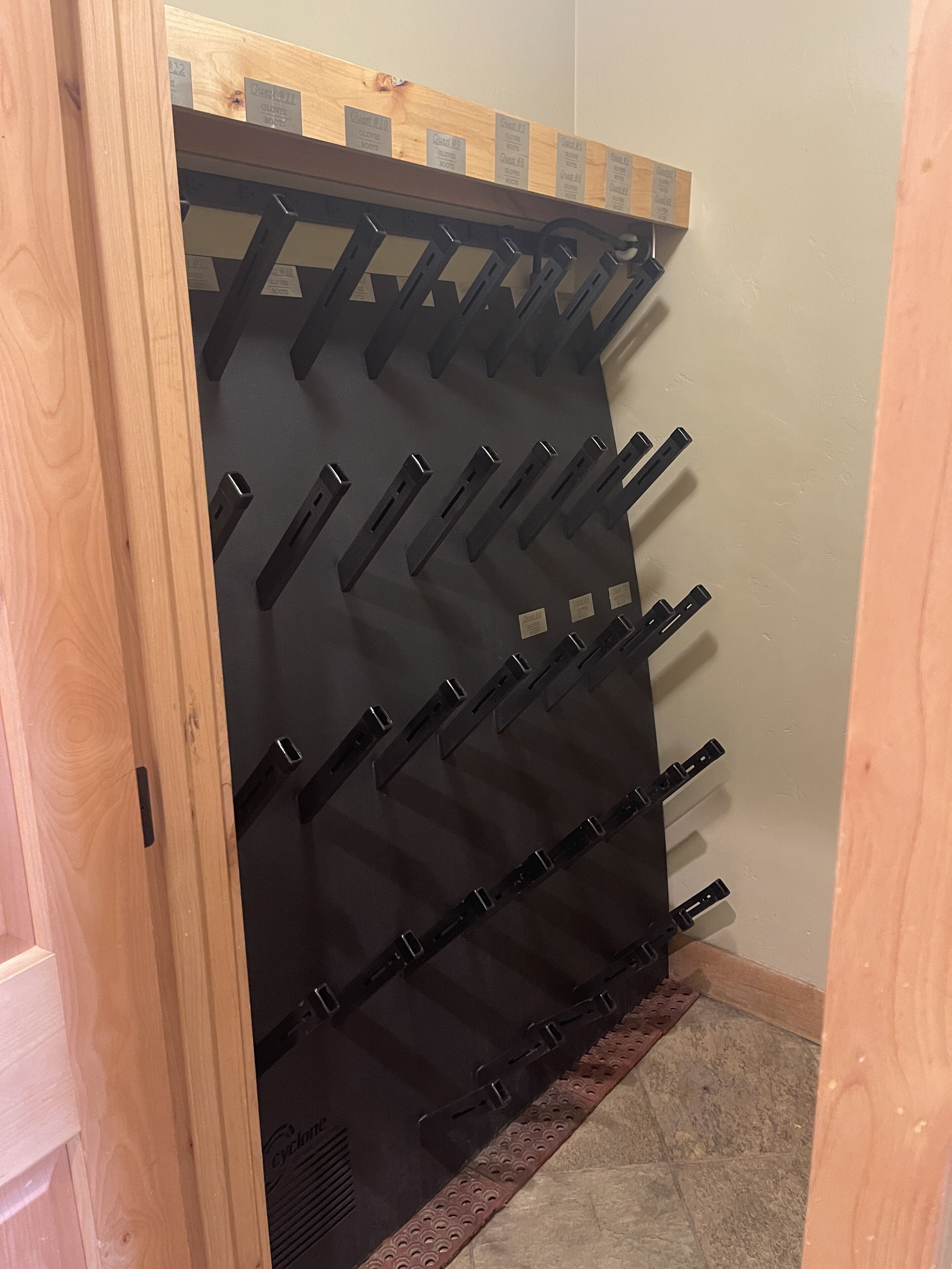 A storage rack with multiple hooks for hanging items.