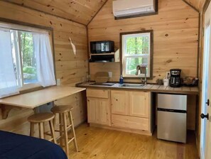 Fridge, microwave, coffee/tea maker, cookware/dishes/utensils