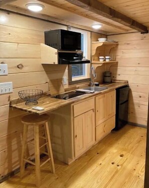 Fridge, microwave, coffee/tea maker, cookware/dishes/utensils
