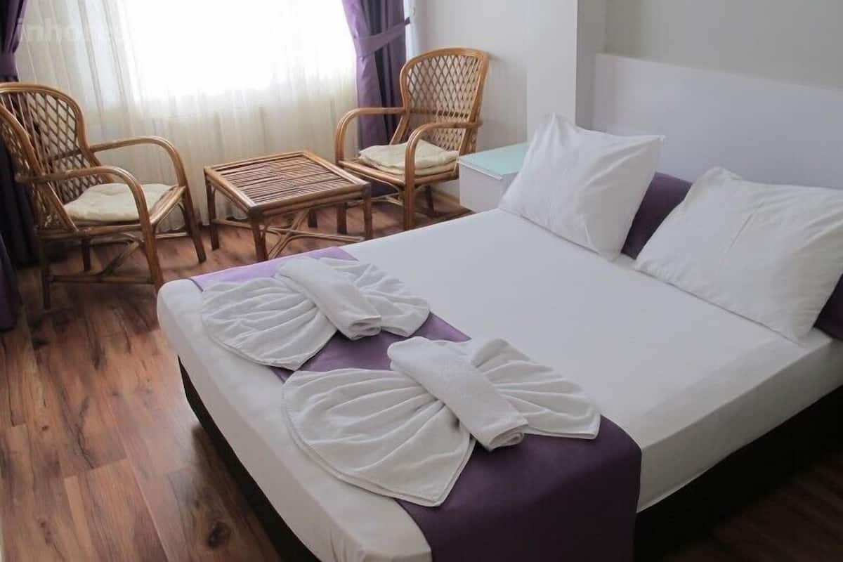 Desk, laptop workspace, bed sheets