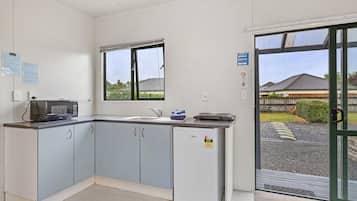 Superior Quadruple Room | Private kitchen | Fridge, microwave