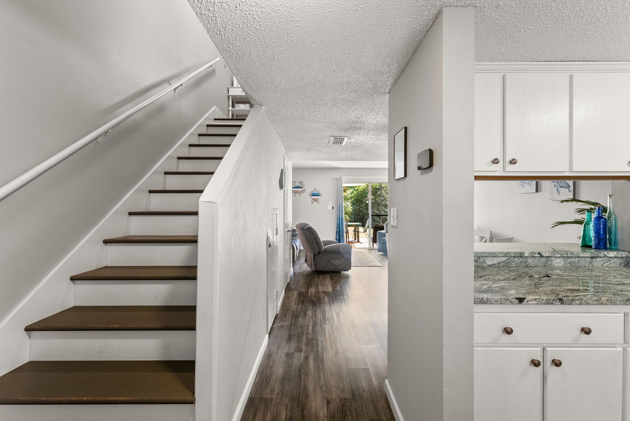 A staircase leading to a living area with a view of the outdoors.