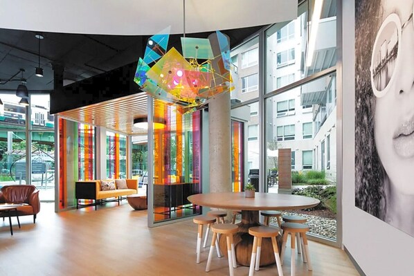 Relax in this stylish space with a large round table and comfortable seating for six, surrounded by expansive views.