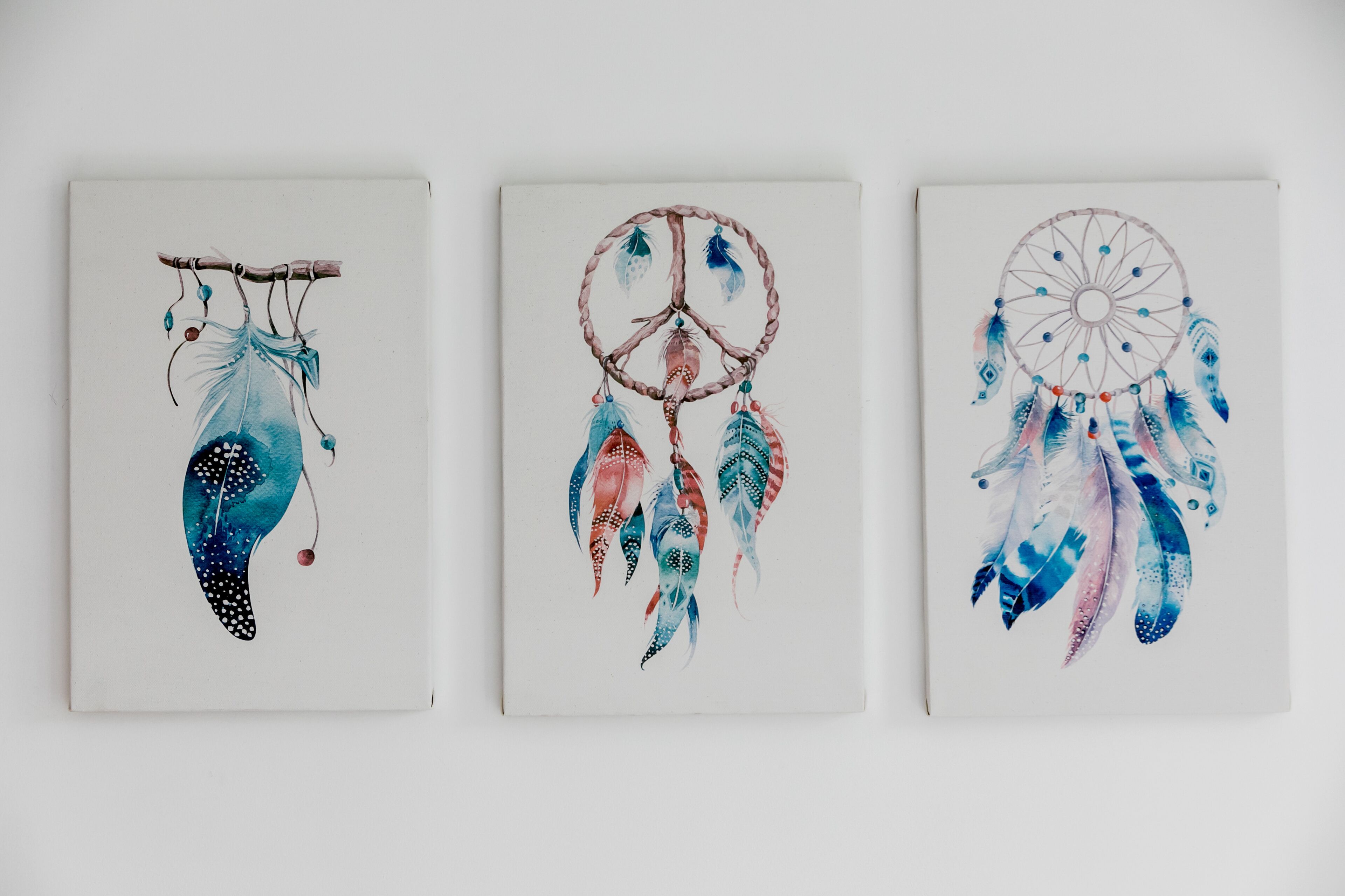 Three dreamcatchers with different designs.