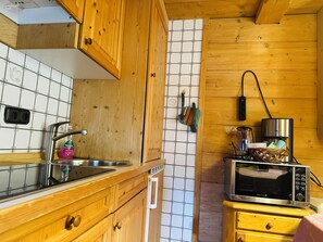 Fridge, microwave, stovetop, coffee/tea maker