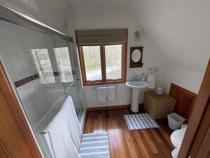 Shower, towels, soap, toilet paper