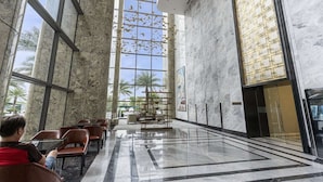 A spacious lobby with high ceilings, large windows, and a modern interior design. - Landmark 81 Serviced Residences (Ho Chi Minh City)