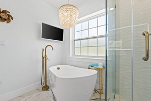 Bathtub, hair dryer, towels, soap