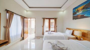 A hotel room with two beds, a painting on the wall, and a balcony with curtains.