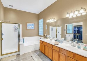Combined shower/tub, hair dryer, towels, soap