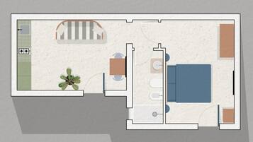 Grundriss eines Hotelzimmers mit Bett, Schreibtisch, Stuhl, kleinem Tisch, Pflanze und einem Badezimmer inklusive Toilette und Waschbecken.