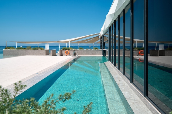 Indoor pool, seasonal outdoor pool, pool umbrellas, pool loungers