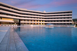 Indoor pool, seasonal outdoor pool, pool umbrellas, pool loungers