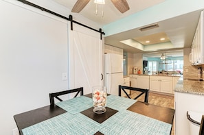 Enjoy cooking in this well-equipped kitchen with a large island, sink, and seating area.