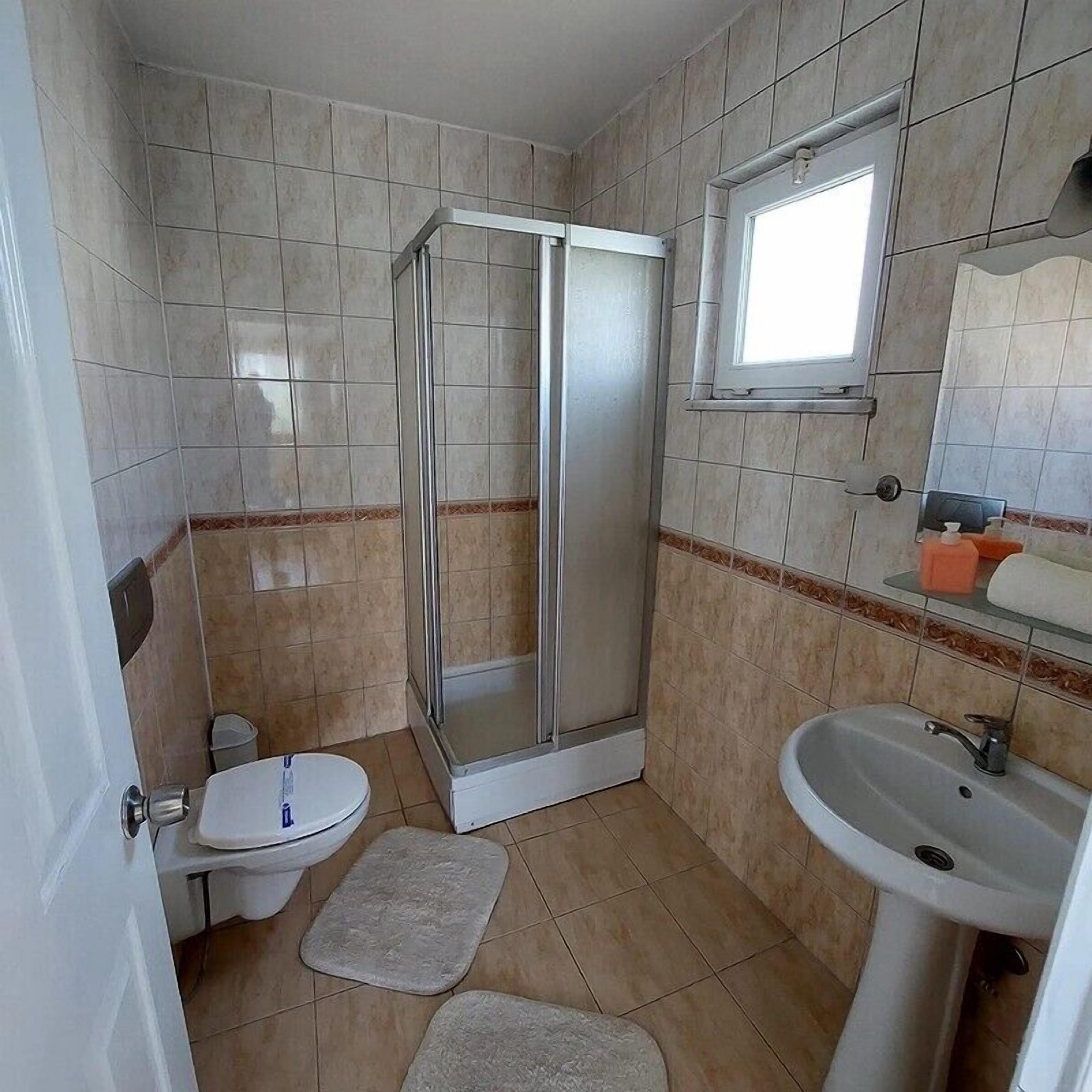 standard room | bathroom | hair dryer, slippers, towels, soap