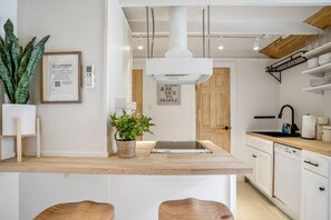 Fridge, microwave, oven, stovetop - Historic Heights Rustic Urban Tiny Cabin (Houston)