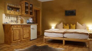 1 bedroom, desk, iron/ironing board, travel crib